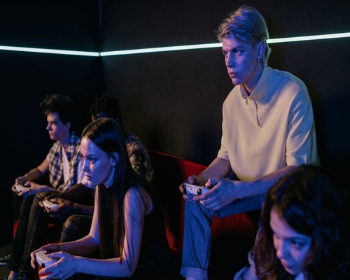 Console players taking part in a Melbourne CROWN gaming challenge