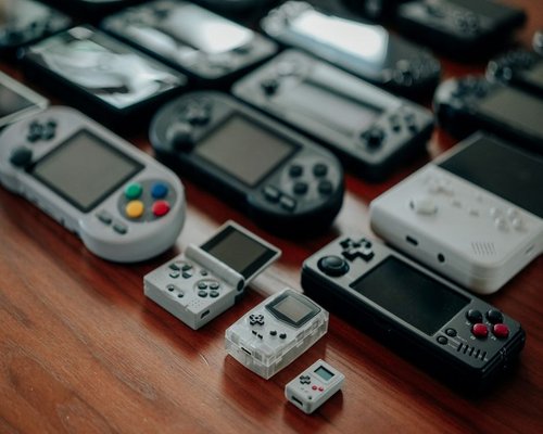 Retro consoles and controllers displayed at a Perth gaming exhibition